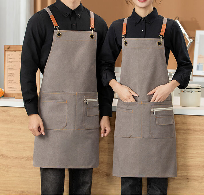 Denim cross back apron with leather straps and zipper pocket for restaurant and cafe uniforms